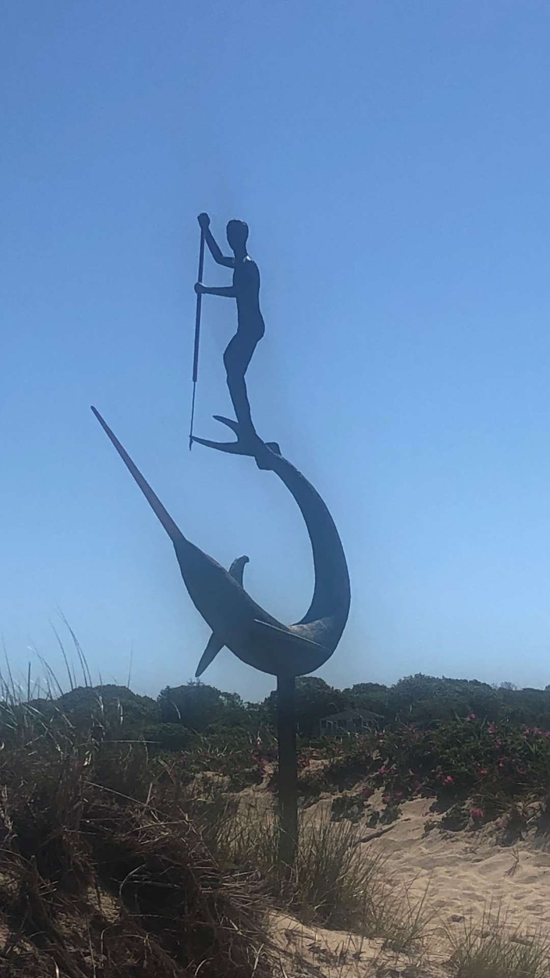 Statue of man spearing fish